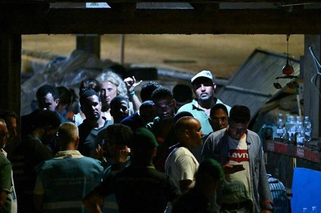 Italian authorities try to identify Lampedusa capsize victims